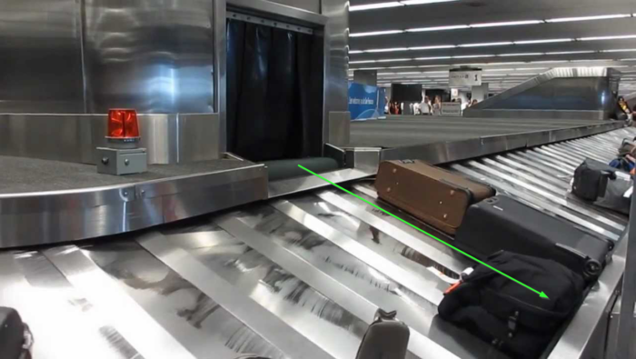 The corner crashes into the metal curb at baggage claim